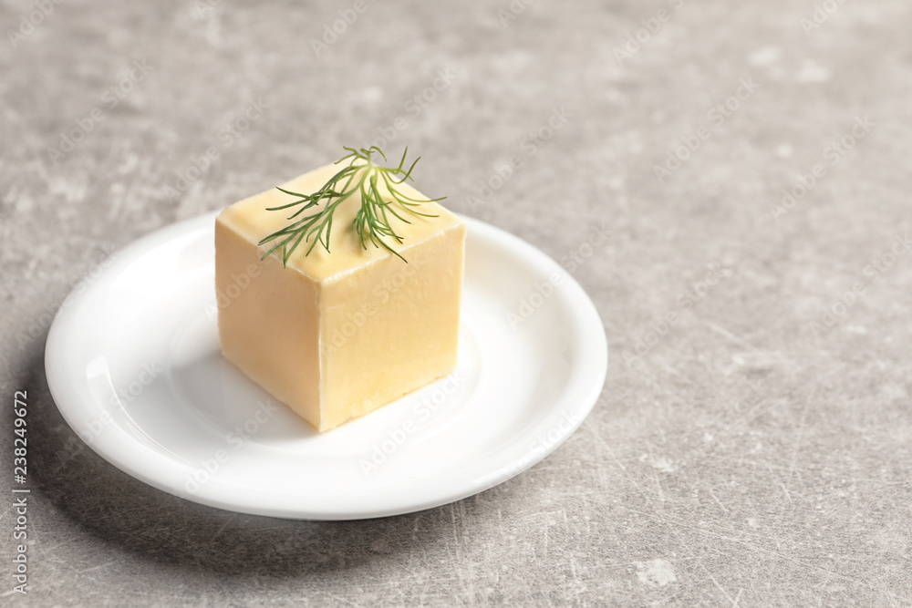 Plate with fresh butter on table. Space for text Plate with fresh butter on table. Space for text