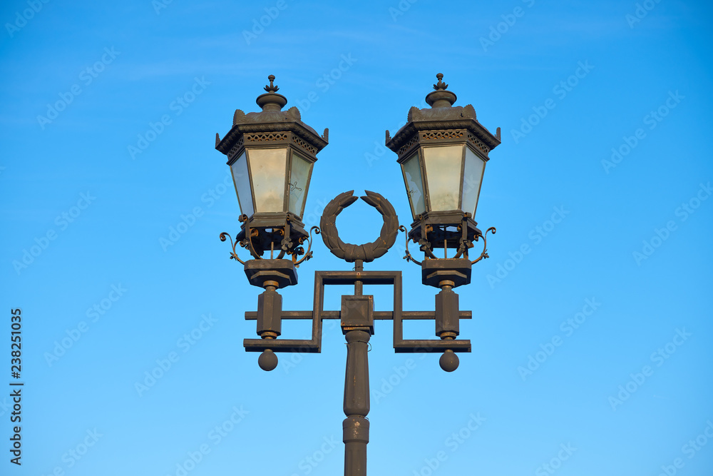 Designed streetlamp on the background of blue sky Designed streetlamp on the background of blue sky