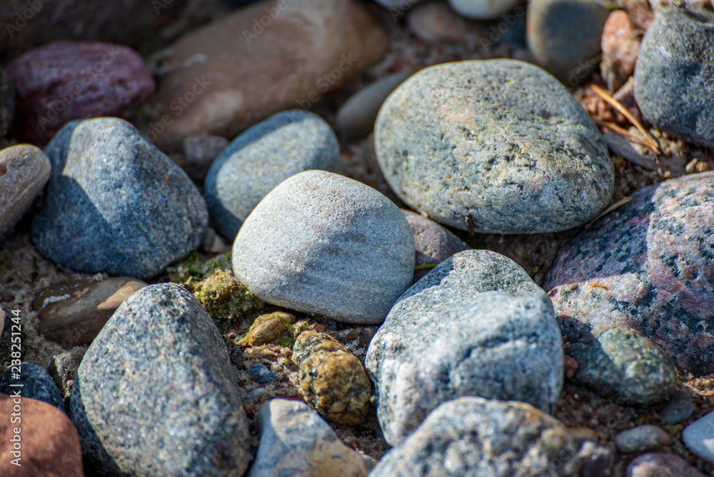 rock covered beach in countryside in Latvia, large rocks in water rock covered beach in countryside in Latvia, large rocks in water