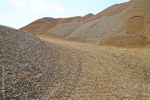 Heaps of sand or macadame and road in a quarry