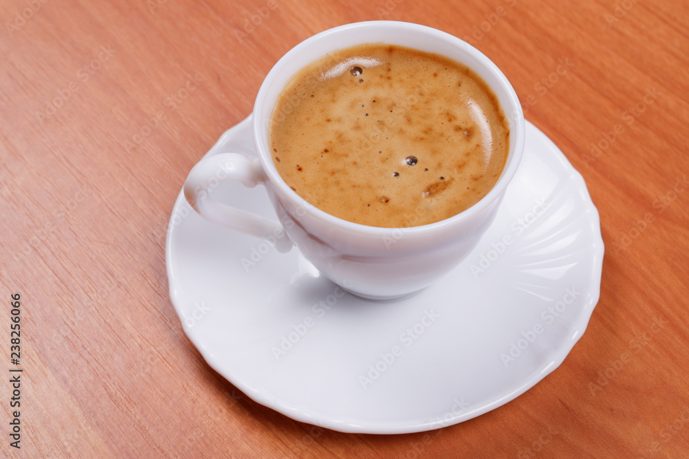Cup of coffee on wooden table. Cup of coffee on wooden table.
