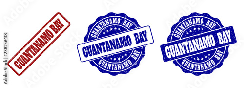 GUANTANAMO BAY grunge stamp seals in red and blue colors. Vector GUANTANAMO BAY labels with grunge surface. Graphic elements are rounded rectangles, rosettes, circles and text labels.