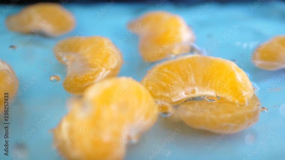 Red yellow apple under water with a trail of transparent bubbles at blue background. Slow motion water splashing concept Red yellow apple under water with a trail of transparent bubbles at blue background. Slow motion water splashing concept