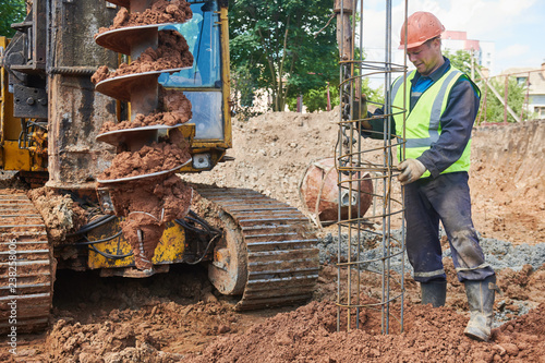 Canvastavla boring holes in ground by drilling rig machine