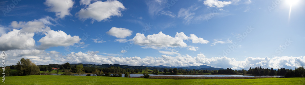allgäu landscape with river and blue sky