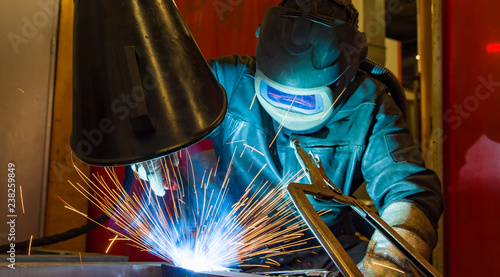 Industrial steel welder in factory welder, craftsman