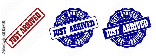 JUST ARRIVED grunge stamp seals in red and blue colors. Vector JUST ARRIVED marks with grunge style. Graphic elements are rounded rectangles, rosettes, circles and text captions.