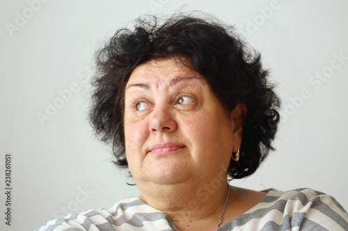 Thoughtful fat woman face with big eyes