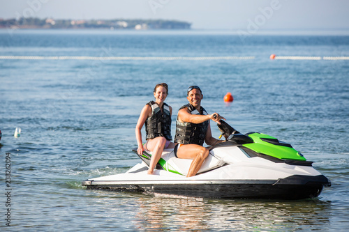 Having fun riding the water scooter