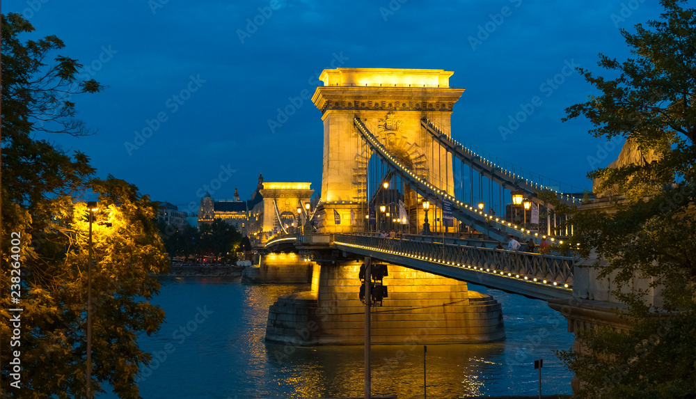Obraz premium Budapest, Hungary. Panoramic view of the Danube River and illuminated Chain Bridge at night