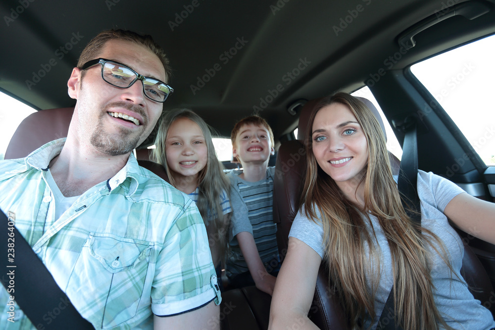 close up. happy family in a comfortable car