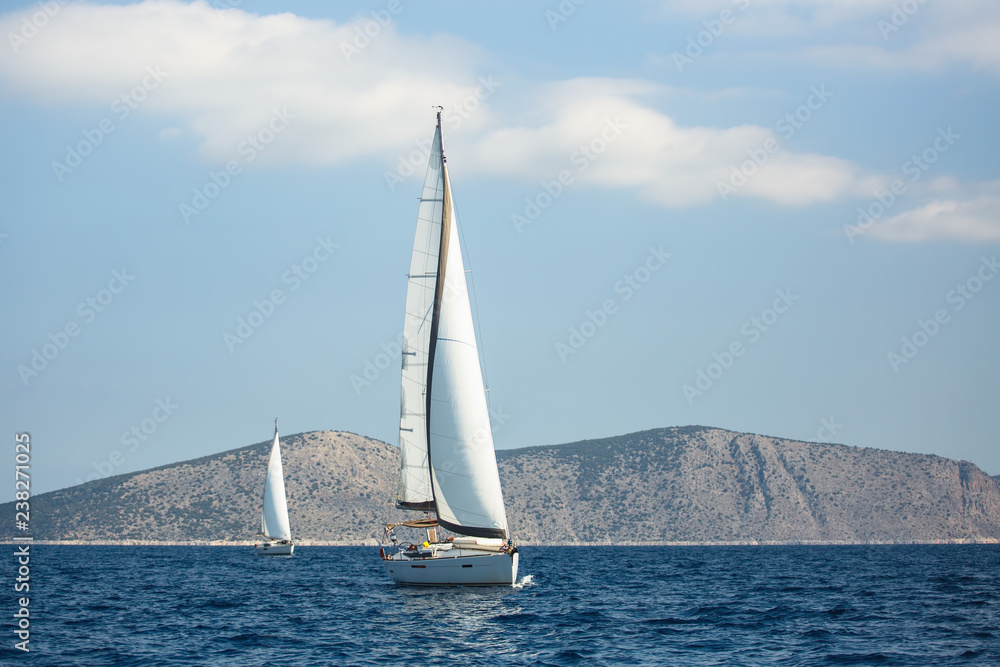 Sailing luxury yacht boats in regatta, Aegean Sea, Greece.