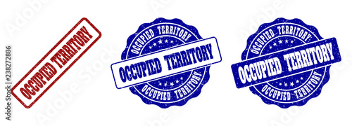 OCCUPIED TERRITORY grunge stamp seals in red and blue colors. Vector OCCUPIED TERRITORY imprints with distress surface. Graphic elements are rounded rectangles, rosettes, circles and text captions.