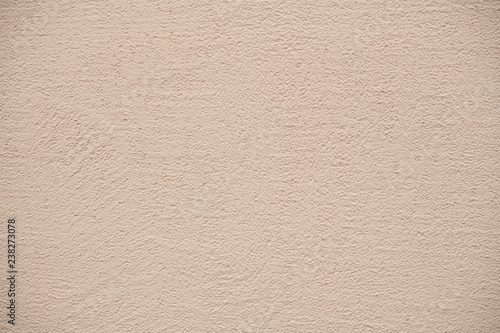 The texture of plastered beige wall, background