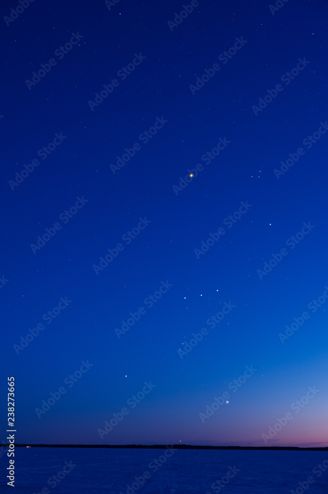 Orion constellation above frozen lake Orion constellation above frozen lake