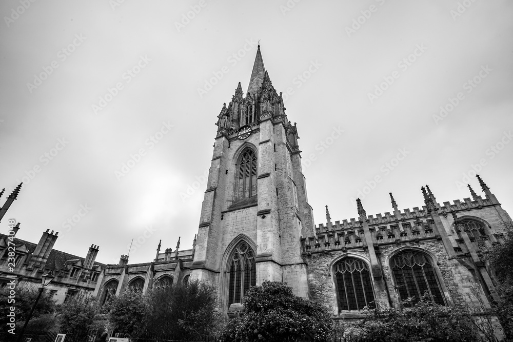 Historical church tower against the skyline in black and white