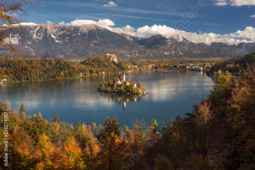 Beautiful mountain lake Bled with small Pilgrimage Church, Slovenia, autumn landscape.
