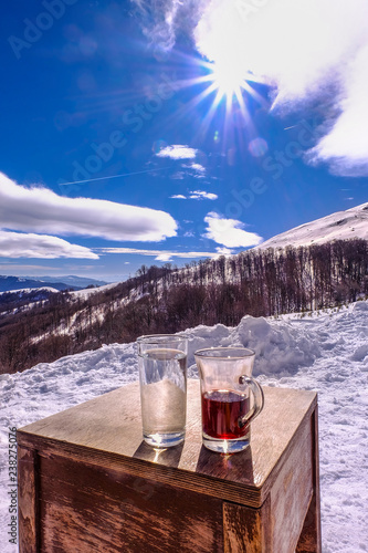 hot wine on mountain top ,snow. ski