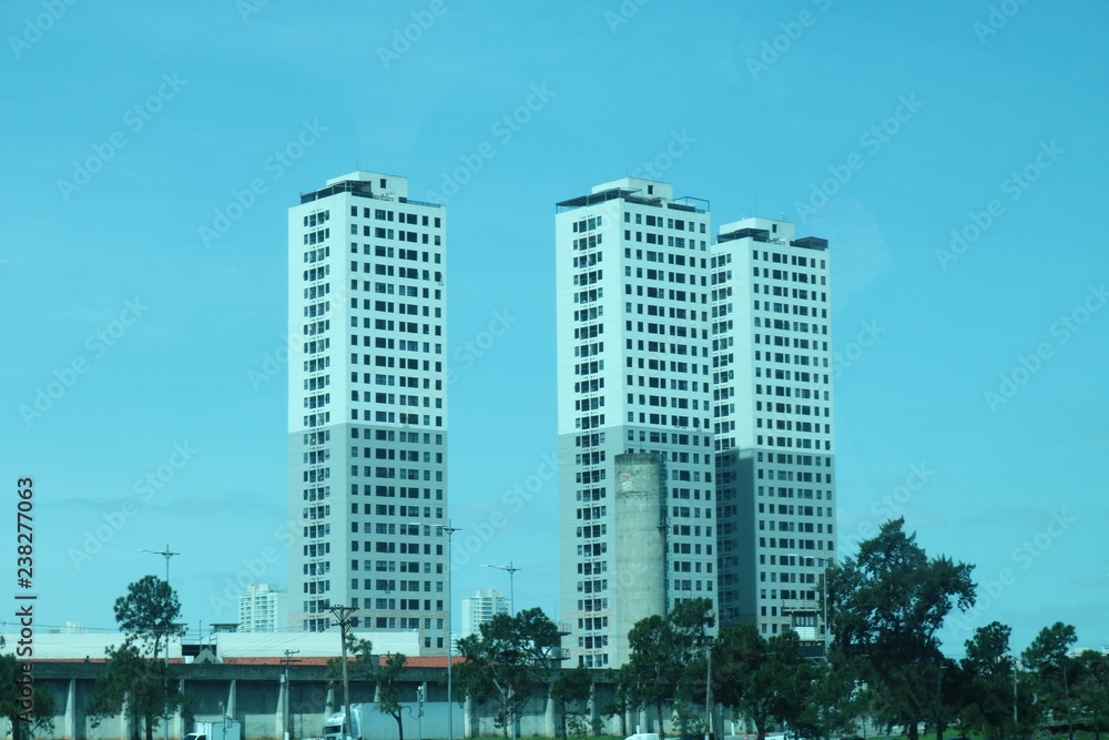 three buildings white three buildings white