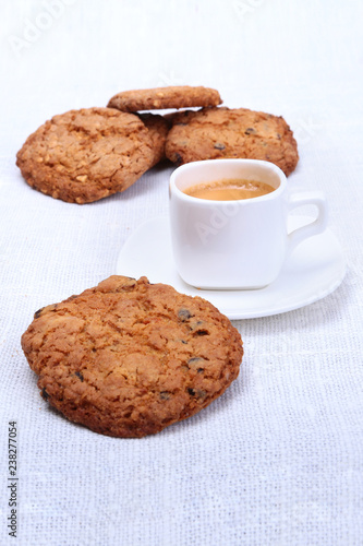 Perfect morning breakfast with Classic espresso in white cup  cake and chocolate on white background.