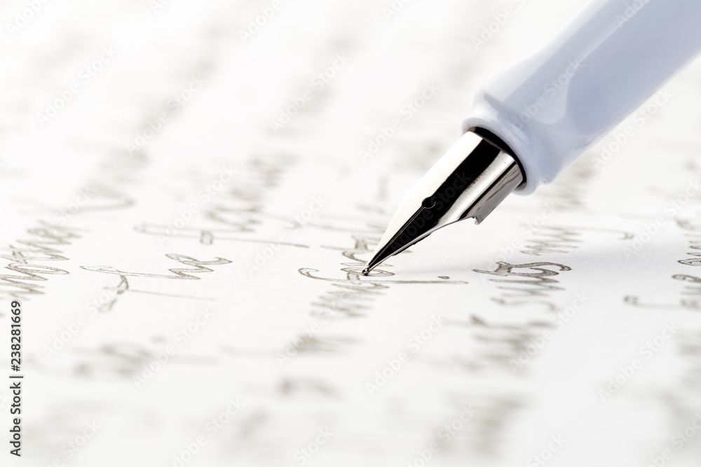 Fototapeta premium white fountain pen writing a letter