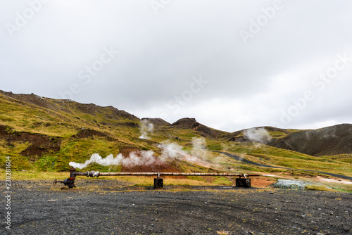 Reykjadalur, Iceland Hveragerdi Hot Springs industrial pipe with steam, during autumn summer morning day, golden circle, landscape, nobody