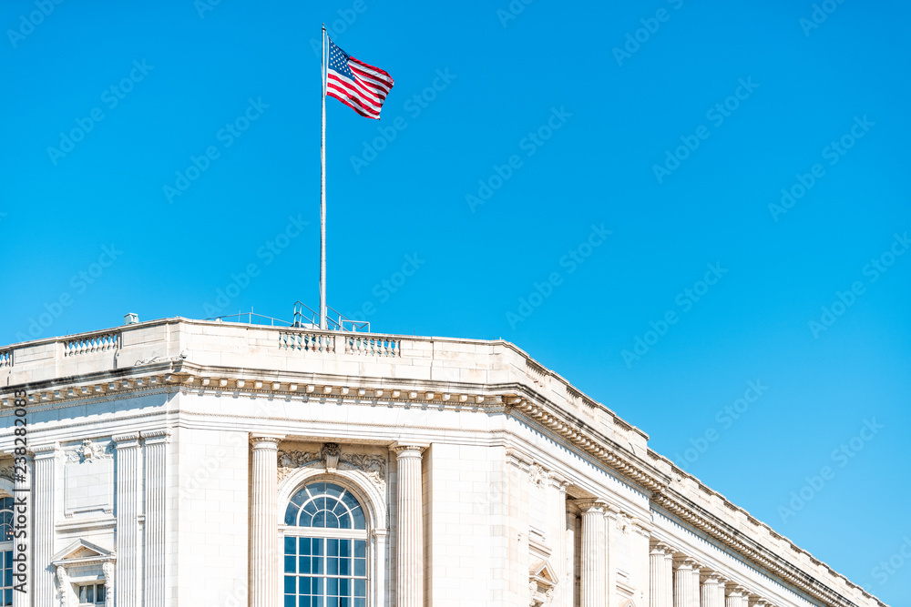Obraz premium Washington DC, USA US Congress on Capital capitol hill, Russell Senate Office building exterior with waving American Flag on pole against blue sky