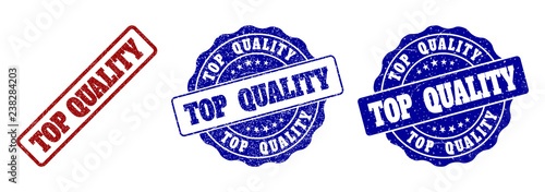 TOP QUALITY grunge stamp seals in red and blue colors. Vector TOP QUALITY marks with grunge effect. Graphic elements are rounded rectangles, rosettes, circles and text captions.