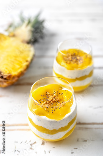 Mango pineapple smoothie with yogurt in two glasses