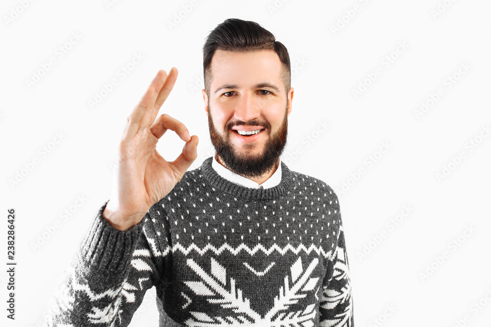 Naklejka premium Portrait of a man with a beard, showing a gesture of approval, gesture well.
