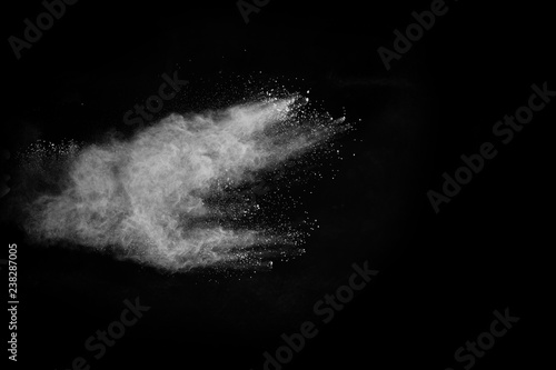 Fototapeta Naklejka Na Ścianę i Meble -  White powder explosion on black background. Colored cloud. Colorful dust explode. Paint Holi.