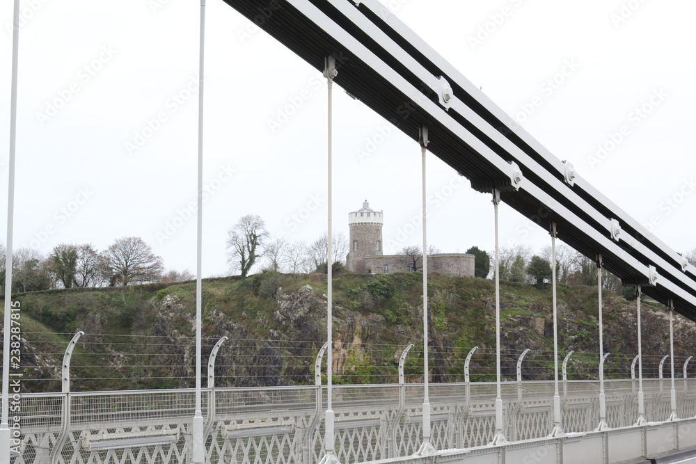 A detail of the deck, the suspender and main cables and the tower of the Clifton Suspension Bridge over the Avon river in Bristol, United Kingdom A detail of the deck, the suspender and main cables and the tower of the Clifton Suspension Bridge over the Avon river in Bristol, United Kingdom