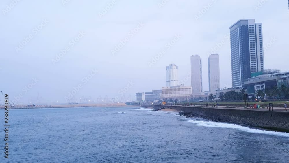 Misty morning at Colombo city of sri lanka with tall buildings and sea near galle face green - time lapse. Misty morning at Colombo city of sri lanka with tall buildings and sea near galle face green - time lapse.