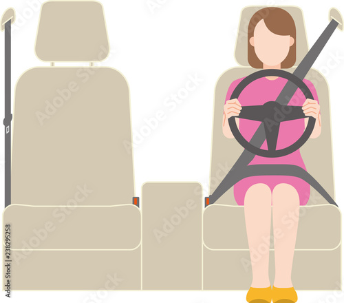 左ハンドルの車を運転する女性