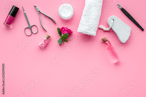 manicure tools set for nail care on rose background top view mock up