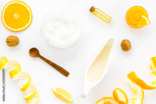 homemade spa with citrus cosmetic oil on white background top view pattern