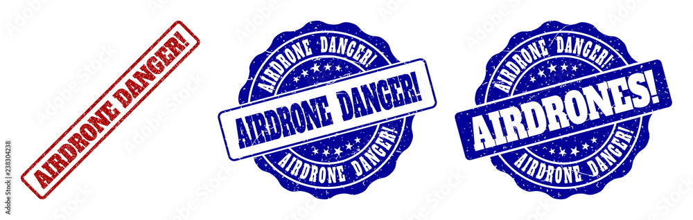 Fototapeta premium AIRDRONE DANGER! grunge stamp seals in red and blue colors. Vector AIRDRONE DANGER! marks with grunge texture. Graphic elements are rounded rectangles, rosettes, circles and text captions.