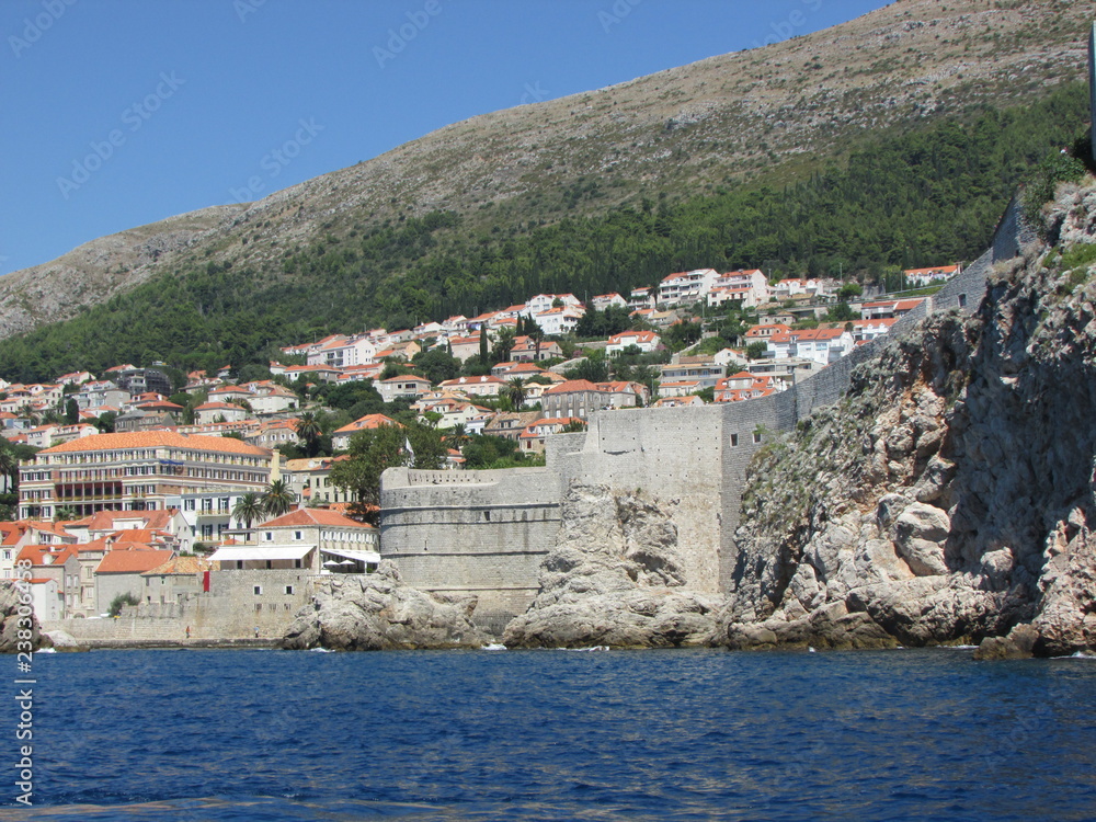 View from adriatic sea to Dubrovnik coast and old town walls, Croatia