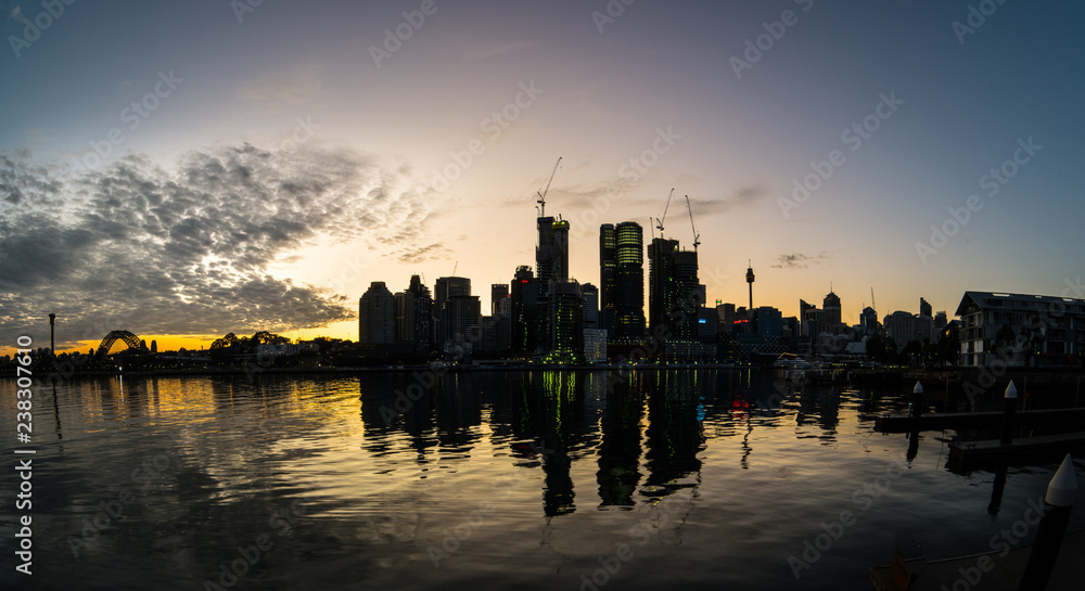 Sydney city in silhouette at sunrise