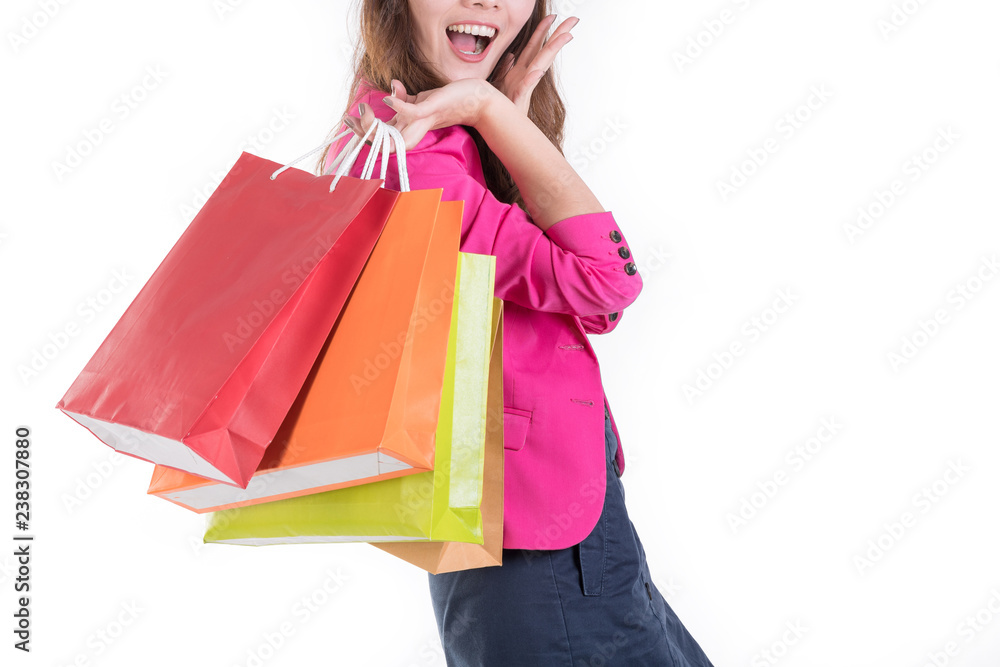 Colorful shopping vibes. Portraits of smiling Asian woman in Trendy clothes with a lot of shopping bags isolated on white.