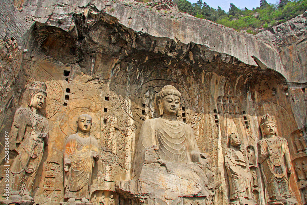 Longmen Grottoe : The Buddha sculpture of Fengxian Cave (or Li Zhi Cave) The world heritage site, Chinese Buddhist art. Located in Louyang, Henan province China. Selective focus. Longmen Grottoe : The Buddha sculpture of Fengxian Cave (or Li Zhi Cave) The world heritage site, Chinese Buddhist art. Located in Louyang, Henan province China. Selective focus.