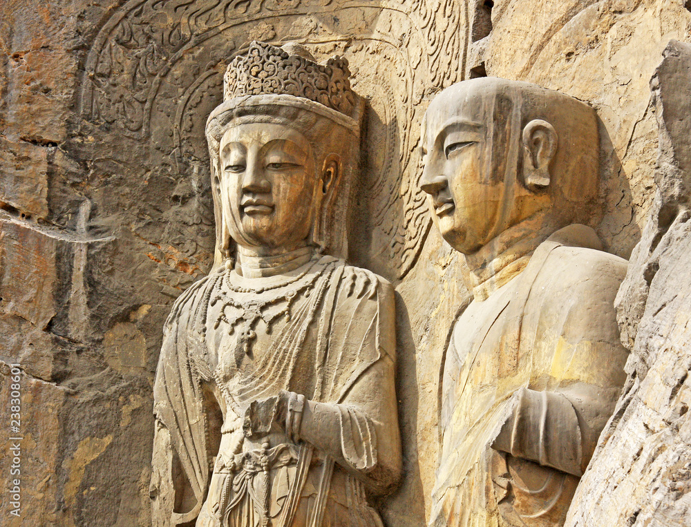 Longmen Grottoes : The Bodhisattava sculptures of Fengxian Cave (or Li Zhi Cave) The world heritage site, Chinese Buddhist art. Located in Louyang, Henan province China. Selective focus.