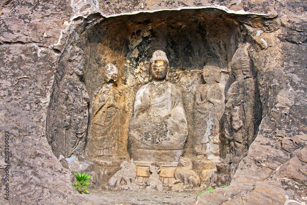 Longmen Grottoe : The world heritage site, Chinese Buddhist art. Housing tens thousands of statues of Buddha and his disciple. Located in Louyang, Henan province China. Selective focus.
