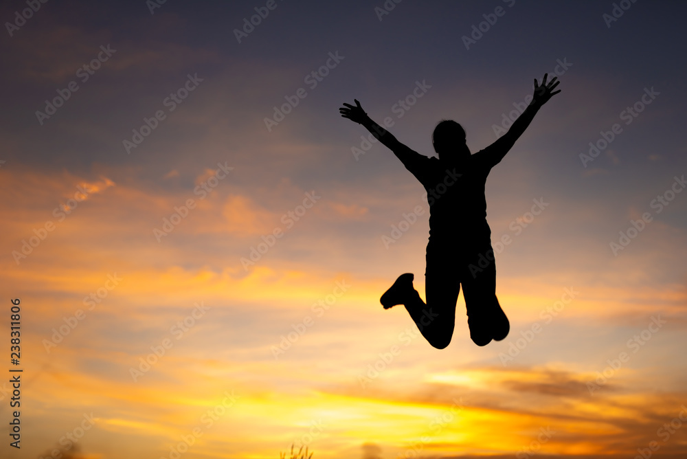 happiness, freedom, motion and people concept - smiling young woman jumping in air sunset background happiness, freedom, motion and people concept - smiling young woman jumping in air sunset background