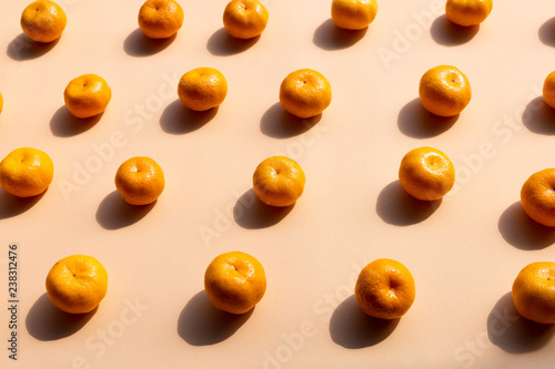 top view pattern Background of whole oranges with strong shadow on orange background