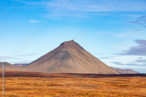 View of the volcano. Beautiful autumn landscape with mountains and bright vegetation. Iceland. Europe