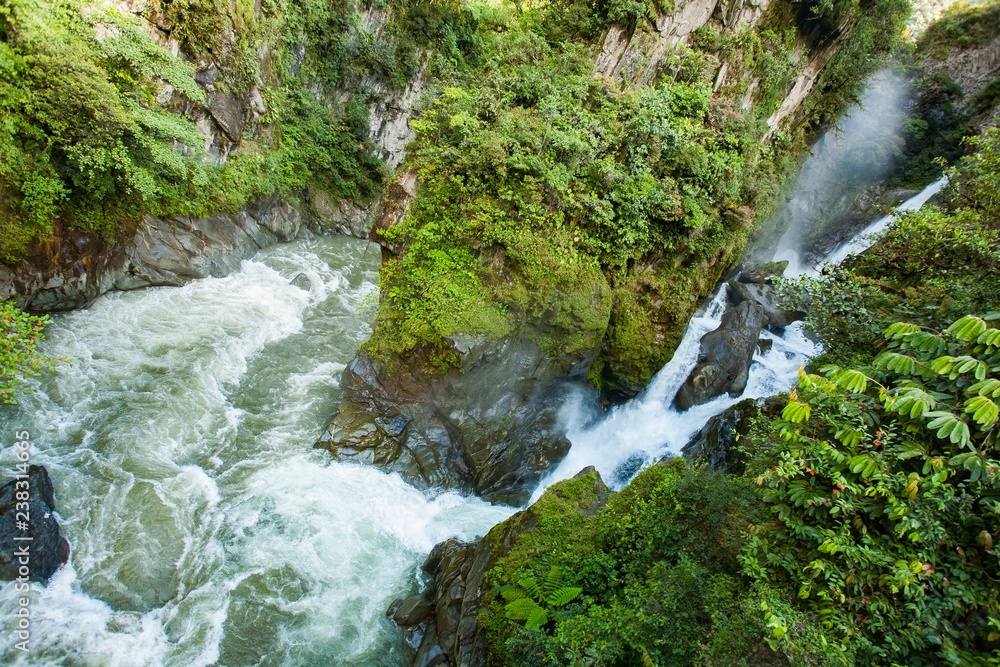 Waterfall Pailon del Diablo (Devil’s Cauldron) in the Andes mountain