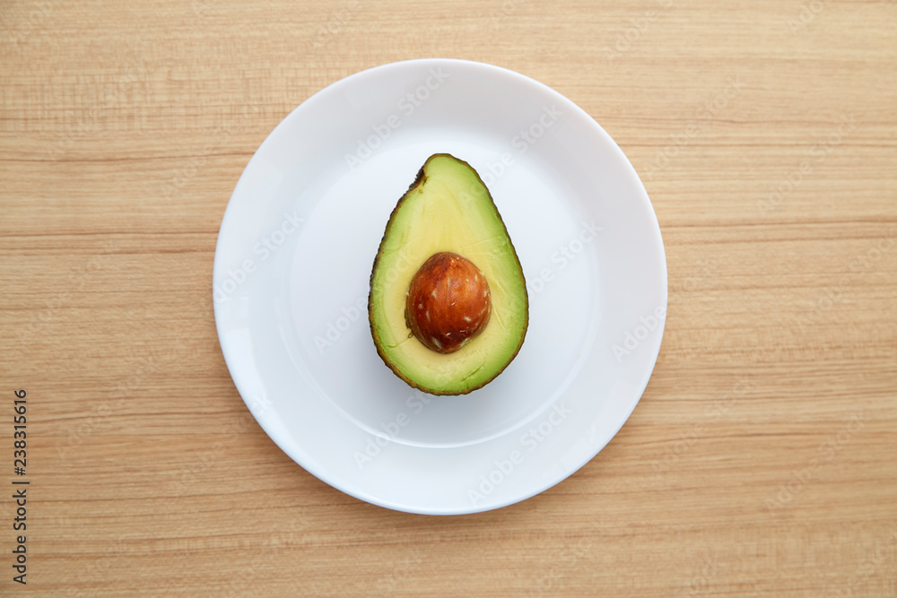 Avocado on white plate Healthy Avocado on white plate Healthy