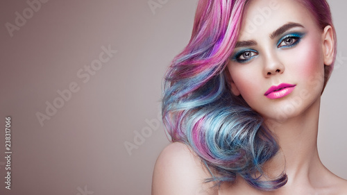Beauty Fashion Model Girl with Colorful Dyed Hair. Girl with perfect Makeup a...