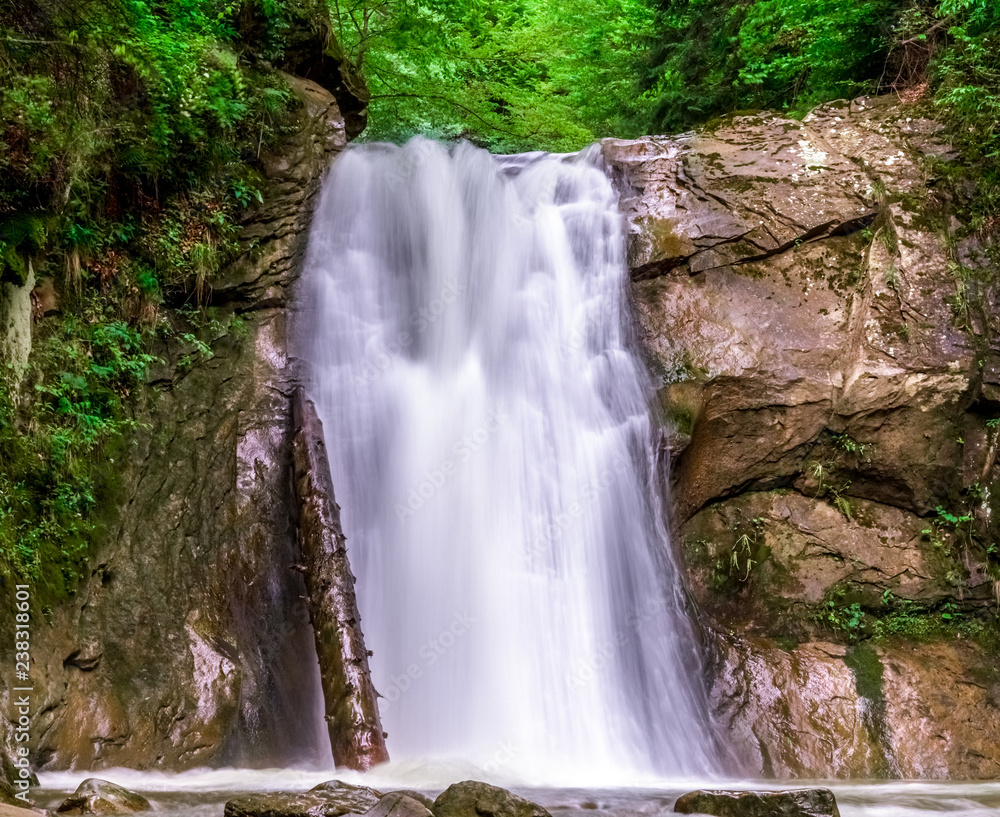 spring nature background. springtime scenery, wilderness landscape wallpaper  with waterfall, cascade on long exposure, rocks and green vegetation in  spring. outdoors, beauty in nature. Stock Photo | Adobe Stock